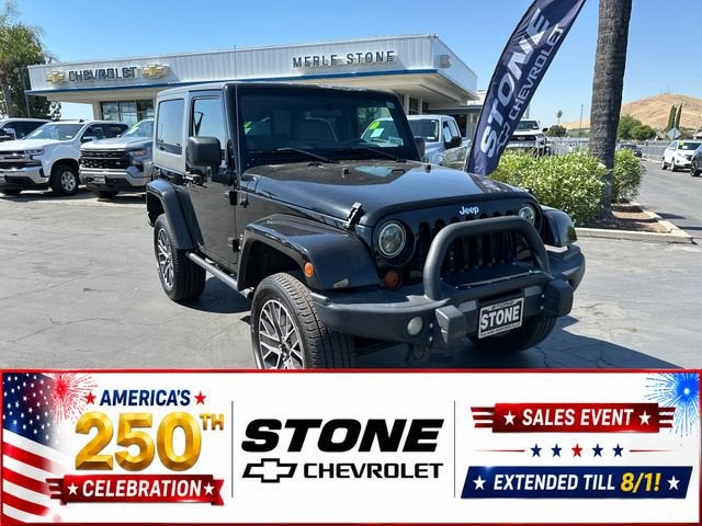 2009 Jeep Wrangler Sahara in Black — front three-quarter view