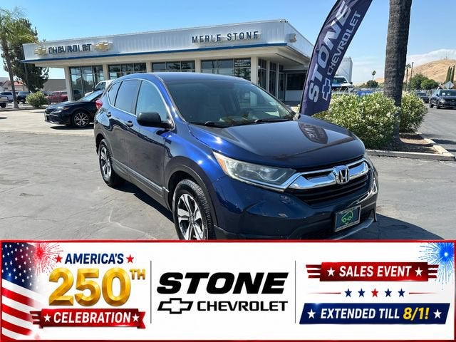 2017 Honda CR-V LX in Blue — front three-quarter view