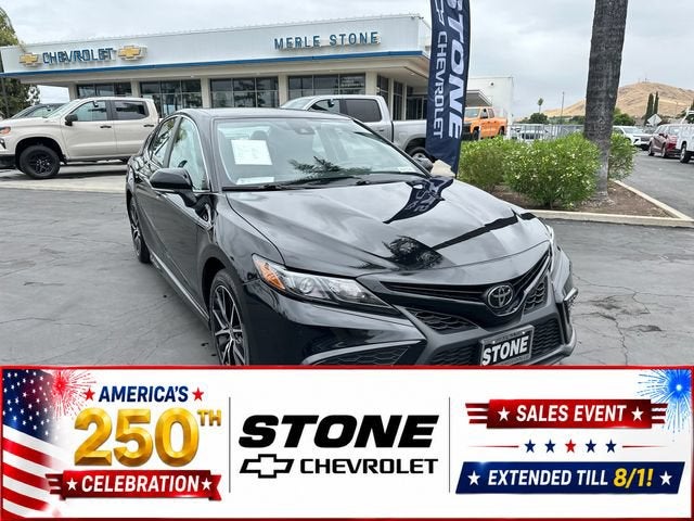 2024 Toyota Camry SE in Black — front three-quarter view